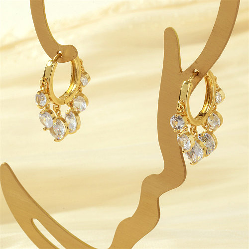 1 par de lujosos pendientes chapados en oro de 18 quilates con incrustaciones redondas brillantes y circonitas de cobre
