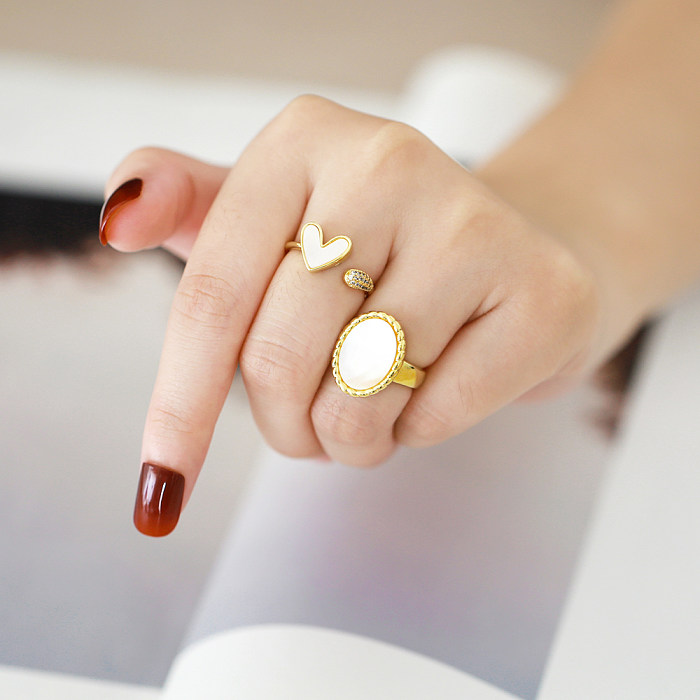 Estilo simples streetwear forma de coração oval revestimento de cobre incrustado concha 18K anéis abertos banhados a ouro