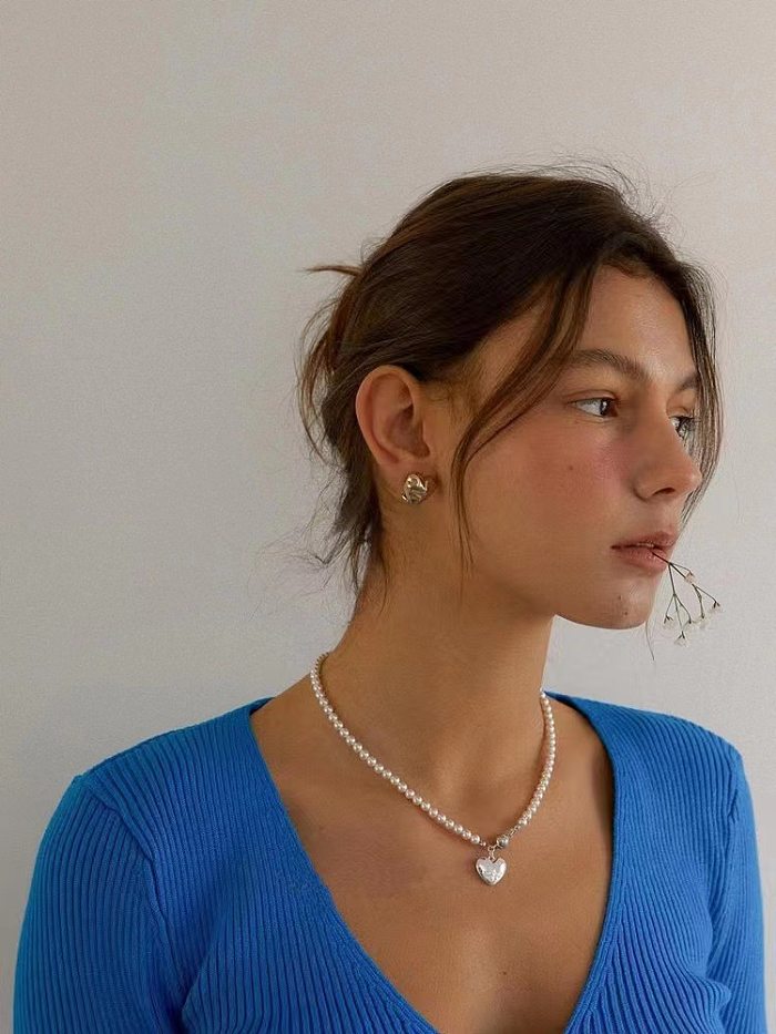 Elegante Damen-Anhänger-Halskette in Herzform mit Imitationsperle und Kupferbeschichtung