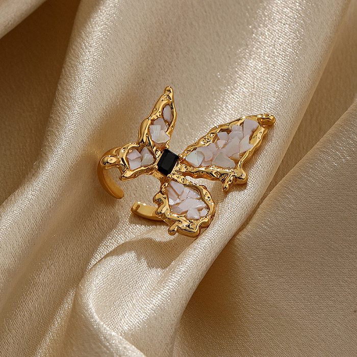 Elegante offene Ringe mit Schmetterlingsverkupferung und Inlay aus Zirkon mit 18-Karat-Vergoldung