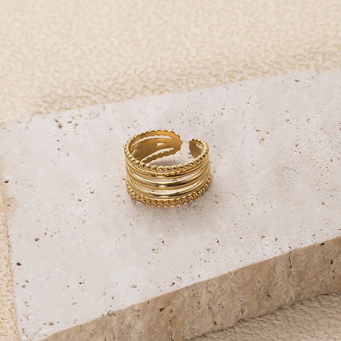 O chapeamento geométrico retro de aço inoxidável do estilo IG escava o anel aberto banhado a ouro 18K