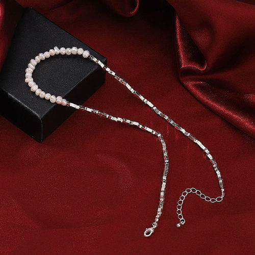 Einfache versilberte Halskette mit unregelmäßiger Kupferperlenbeschichtung