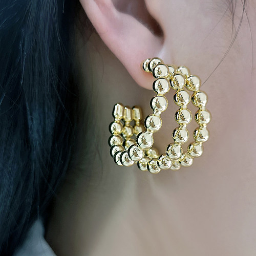 1 paire de clous d'oreilles en cuivre plaqué or, Style Simple, en forme de C, en trois dimensions