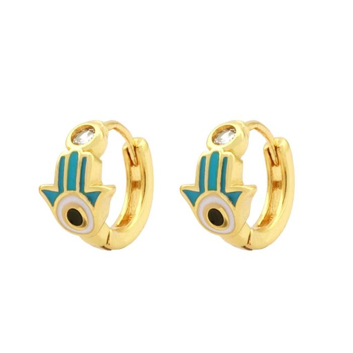 1 paire de boucles d'oreilles plaquées or 18 carats avec incrustation de pierres précieuses artificielles en cuivre de style classique