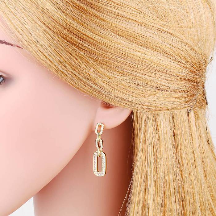Nouveau Boucles d'oreilles géométriques ovales en cuivre plaqué or, incrustées