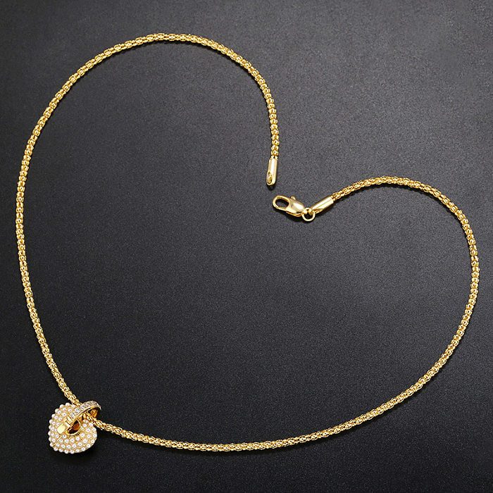 Collier avec pendentif en forme de cœur avec incrustation en laiton et zircon, 1 pièce