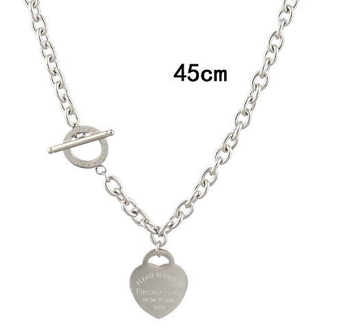 Venta al por mayor Collar de pulseras de anillos de acero de titanio con forma de corazón de estilo simple