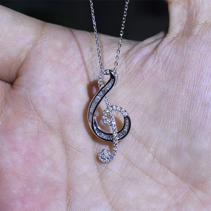Modische Halskette in Form einer Musiknote mit eingelegtem Zirkon und Kupfer