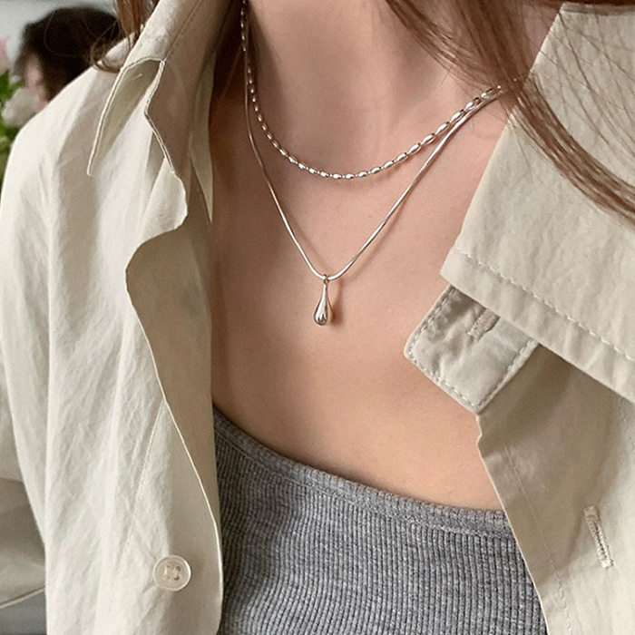 Nouveau collier minimaliste de perles d'olive Double couche en argent galvanisé, Ins Niche Normcore sac goutte d'eau pendentif tempérament chaîne de clavicule