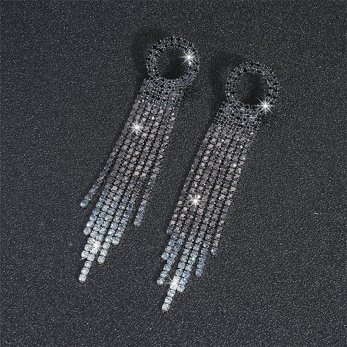 1 par de pendientes colgantes chapados en plata con incrustaciones de cobre y diamantes de imitación