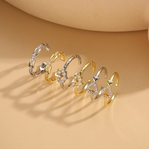 Offene Ringe in Herzform im IG-Stil mit einfarbiger Kupferbeschichtung und Inlay aus Zirkon mit 14-Karat-Vergoldung