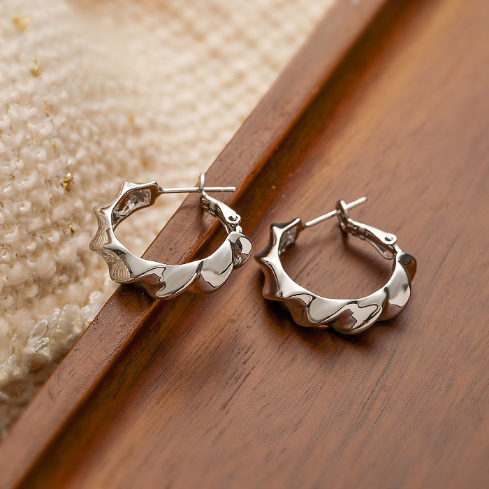1 paire de boucles d'oreilles plaquées or 18 carats en cuivre plaqué géométrique de style simple
