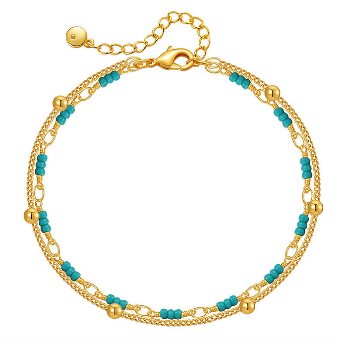Runde, türkisfarbene, mit 18 Karat vergoldete Armbänder im klassischen Stil