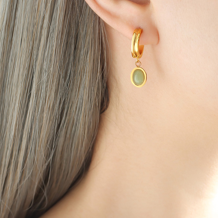 Großhandel mit eleganten ovalen Ohrringen und Halsketten aus Titanstahl mit 18 Karat vergoldetem Naturstein