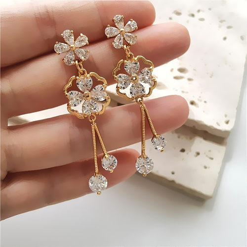 1 paire de boucles d'oreilles pendantes en cuivre et Zircon avec incrustation de fleurs douces