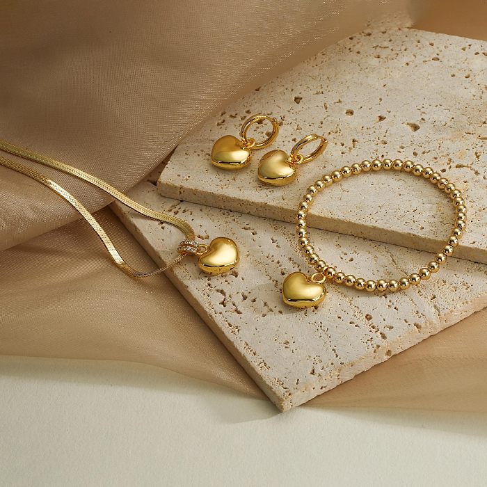 Collar de pendientes de pulseras de circón con incrustaciones de cobre en forma de corazón de estilo simple