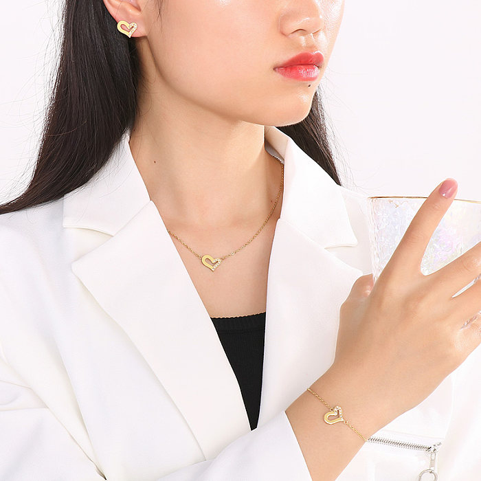 Lässige Streetwear-Ohrringe in Herzform mit 18 Karat vergoldeter Titanstahlbeschichtung