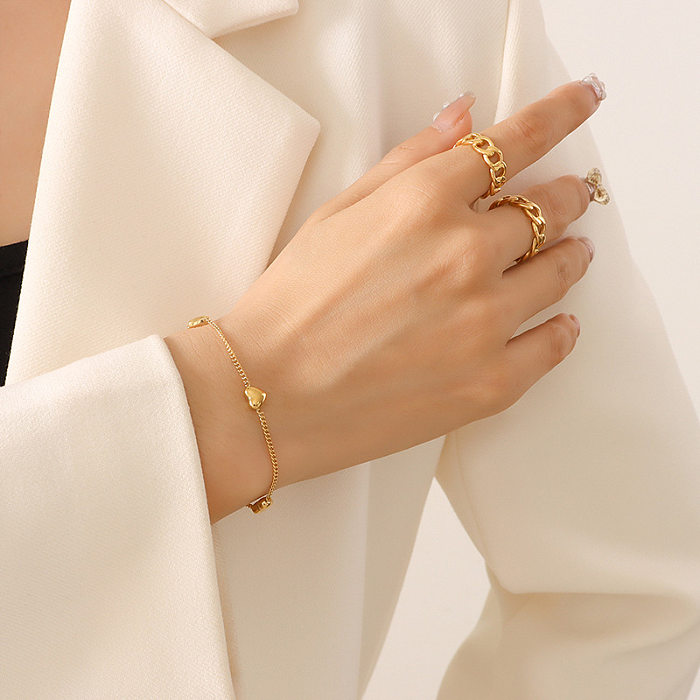 Collar en forma de corazón de moda Pulsera femenina Conjunto de joyas chapadas en oro de acero de titanio