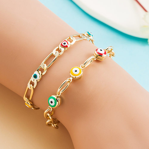 Pulsera creativa chapada en oro de 18 quilates con incrustaciones de cobre y ojo de diablo