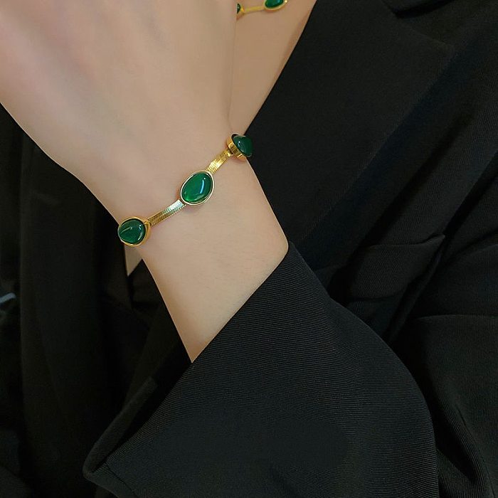 Elegante Retro-geometrische Edelstahl-Beschichtung, künstliche Edelsteine, 18 Karat vergoldet, Armbänder, Ohrringe, Halskette