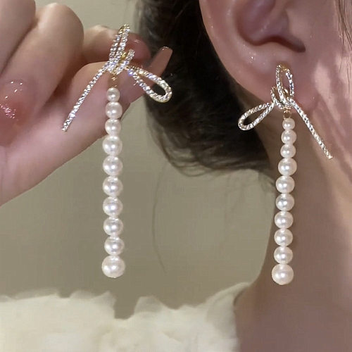 1 Paar Lady Pearl Bow Knot Unregelmäßige Perlen Inlay Kupfer Zirkon Tropfenohrringe