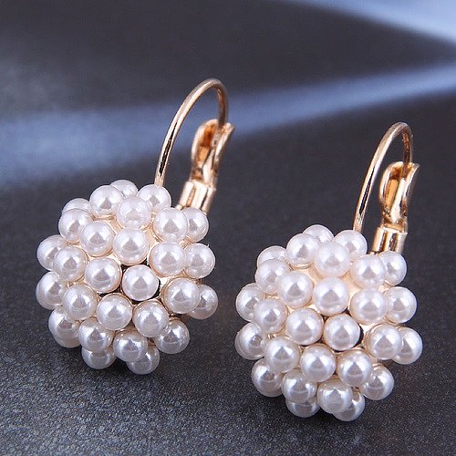 1 paire de clous d'oreilles en perles de cuivre avec incrustation géométrique élégante