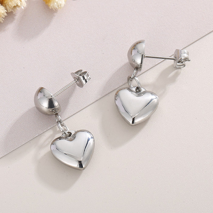Collier de boucles d'oreilles de bracelets plaqués or 18K de placage d'acier de titane de forme de coeur de style moderne