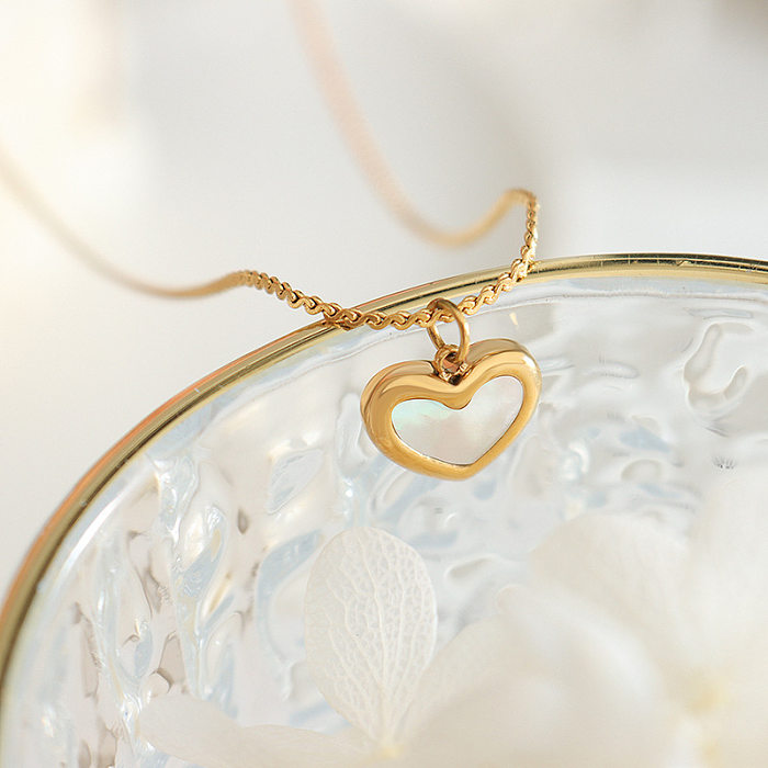 Collier élégant de boucles d'oreilles de Bracelets de coquille d'incrustation en acier de titane de forme de coeur pour femmes
