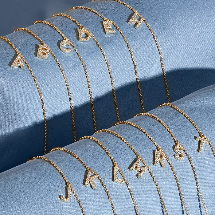 Modische Buchstaben-Armbänder aus Messing mit Inlay-Zirkon-Kupfer-Armbändern