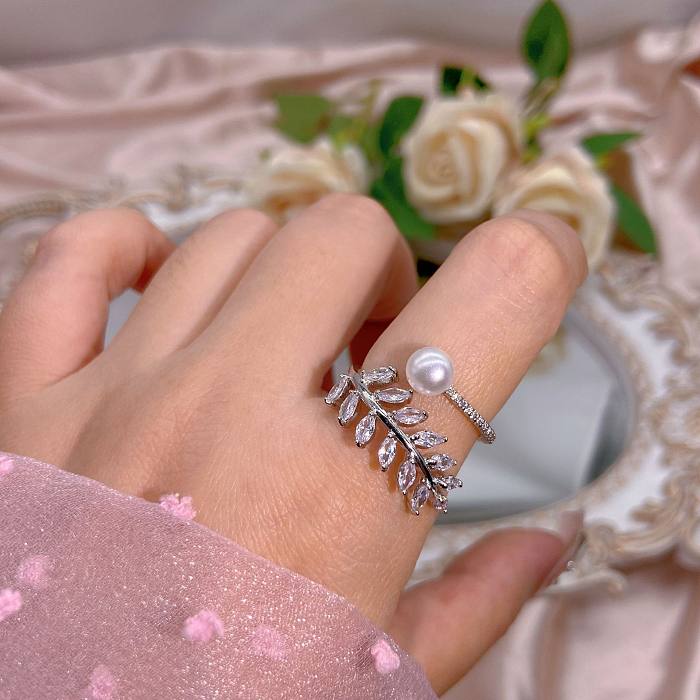 Einfache herzförmige offene Ringe mit Blumen- und Schleifenknoten, Kupfereinlage und Zirkon