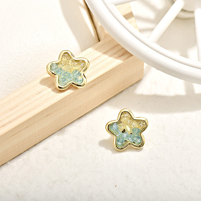 1 paire de clous d'oreilles en cristal de cuivre avec incrustation d'étoiles de style simple