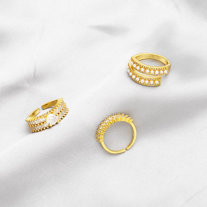 Schlichter Stil, rund, verkupfert, Inlay-Perlen, Zirkon, 18 Karat vergoldet, offene Ringe
