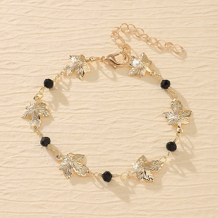 Moderne Teufelsauge-Schmetterlingsarmbänder aus Kupfer mit Perlenbeschichtung und vergoldet