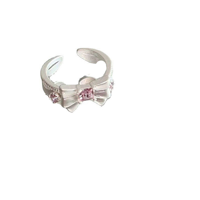 Elegante Ringe mit Schleifenknoten, Kupferbeschichtung und Inlay aus Zirkon