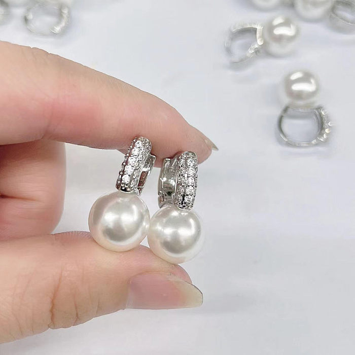 1 Paar modische geometrische Kupfer-Inlay-künstliche Perlen-Zirkon-Ohrringe