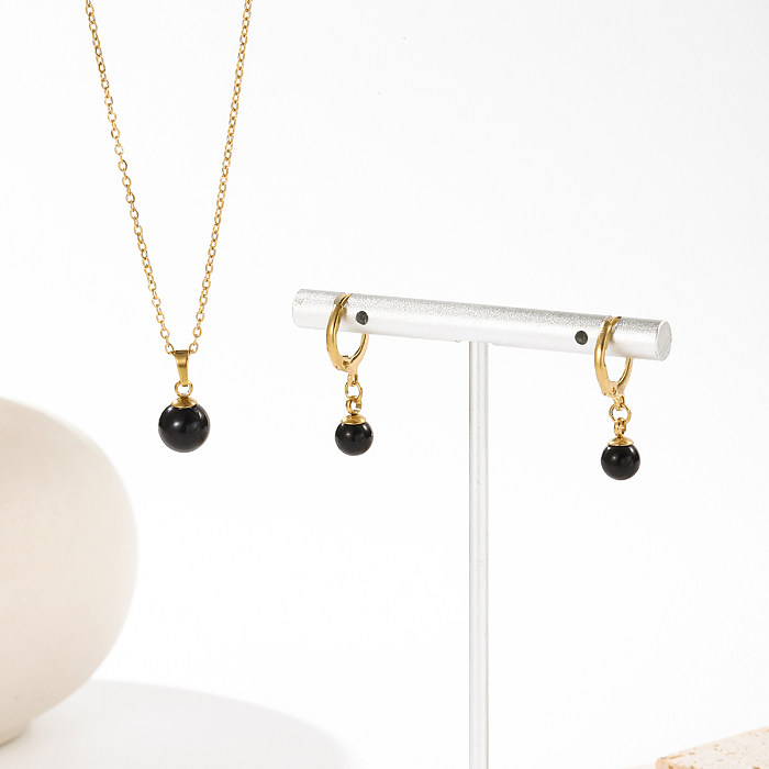 Collar de pendientes chapado en oro de 14 quilates con revestimiento de perlas de imitación de acero inoxidable redondo brillante de estilo simple