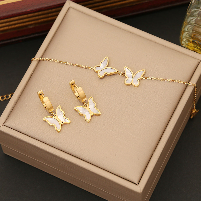 Elegante Schmetterlings-Edelstahl-Schichtplattierung mit Muschel-Armbändern, Ohrringen und Halskette