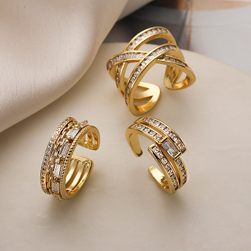 Schlichter Stil, offener Ring mit Kreuzverkupferung, Inlay aus Zirkon und 18-Karat-Vergoldung