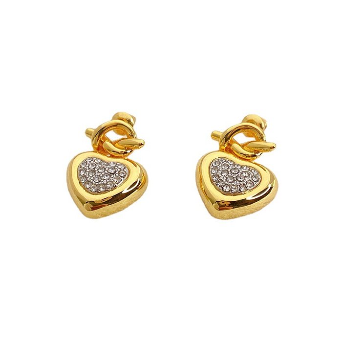1 paire de clous d'oreilles plaqués or 18 carats avec incrustation de cuivre en forme de cœur pour femme