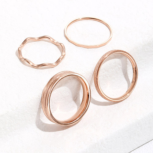 Conjunto de anel simples de ondulação de água em ouro rosa de aço titânio da moda