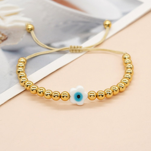 Bracelets faits à la main en perles de cuivre et de verre de fleur d'oeil de style ethnique