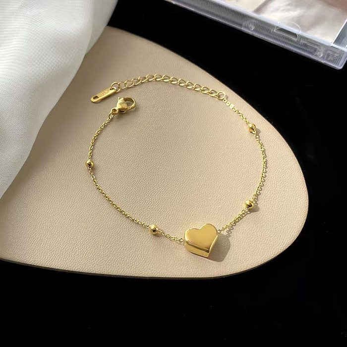 1 pièce de bracelets de cheville en acier titane en forme de cœur doux pour femmes