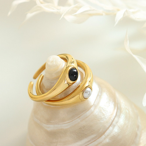 Elegante, schlichte Ringe mit geometrischer Titanstahlbeschichtung und Glasperle, 18 Karat vergoldet