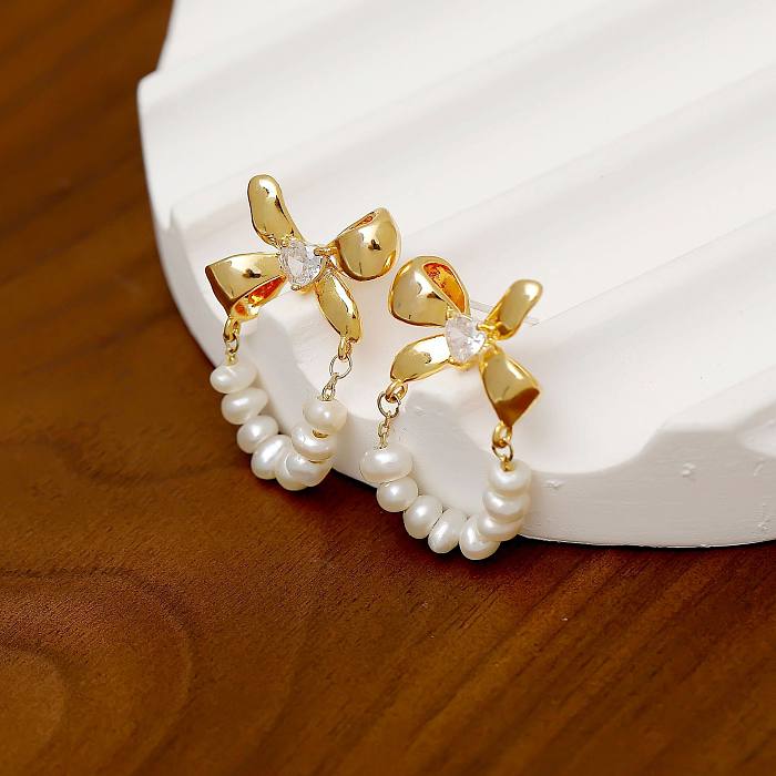 1 Pair Sweet Simple Style Bow Knot Plating Inlay Freshwater Pearl Copper Zircon 18K Gold Plated Earrings