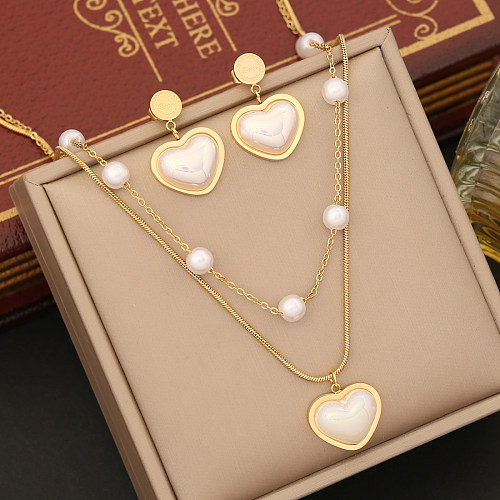Collier élégant de boucles d'oreilles de bracelets de perle d'incrustation de placage d'acier inoxydable de forme de coeur
