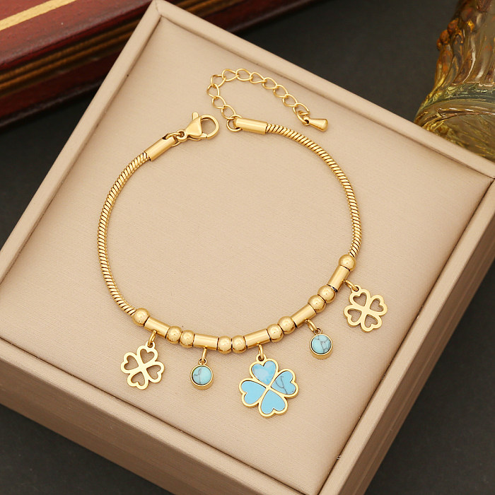 Elegante Blumen-Edelstahl-Beschichtung, türkisfarbene Armbänder, Ohrringe und Halskette