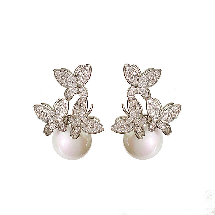 1 par de pendientes bonitos con incrustaciones de mariposa, perlas de imitación, circonitas de cobre