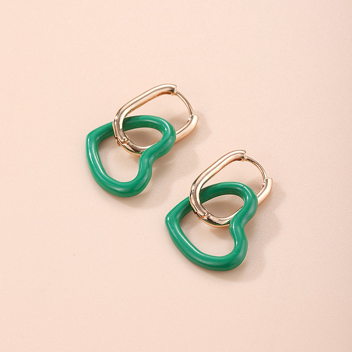 1 paire de jolies boucles d'oreilles pendantes en forme de cœur plaqué cuivre