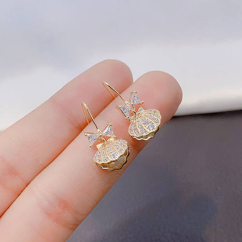 1 paire de perles artificielles en cuivre et Zircon, Style Simple, incrustation de coquille de nœud papillon, crochet d'oreille