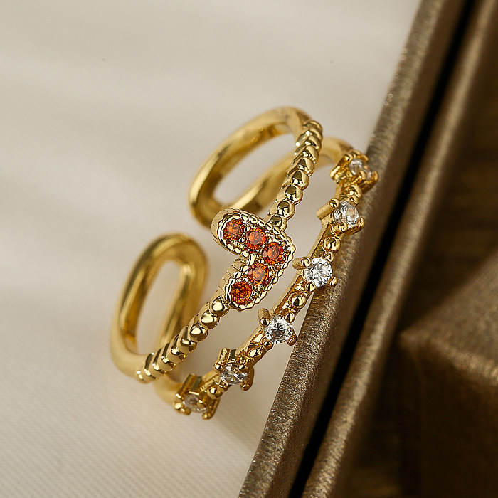 Moderner offener Ring in herzförmiger Form mit Kupferbeschichtung und Zirkoneinlage, 18 Karat vergoldet